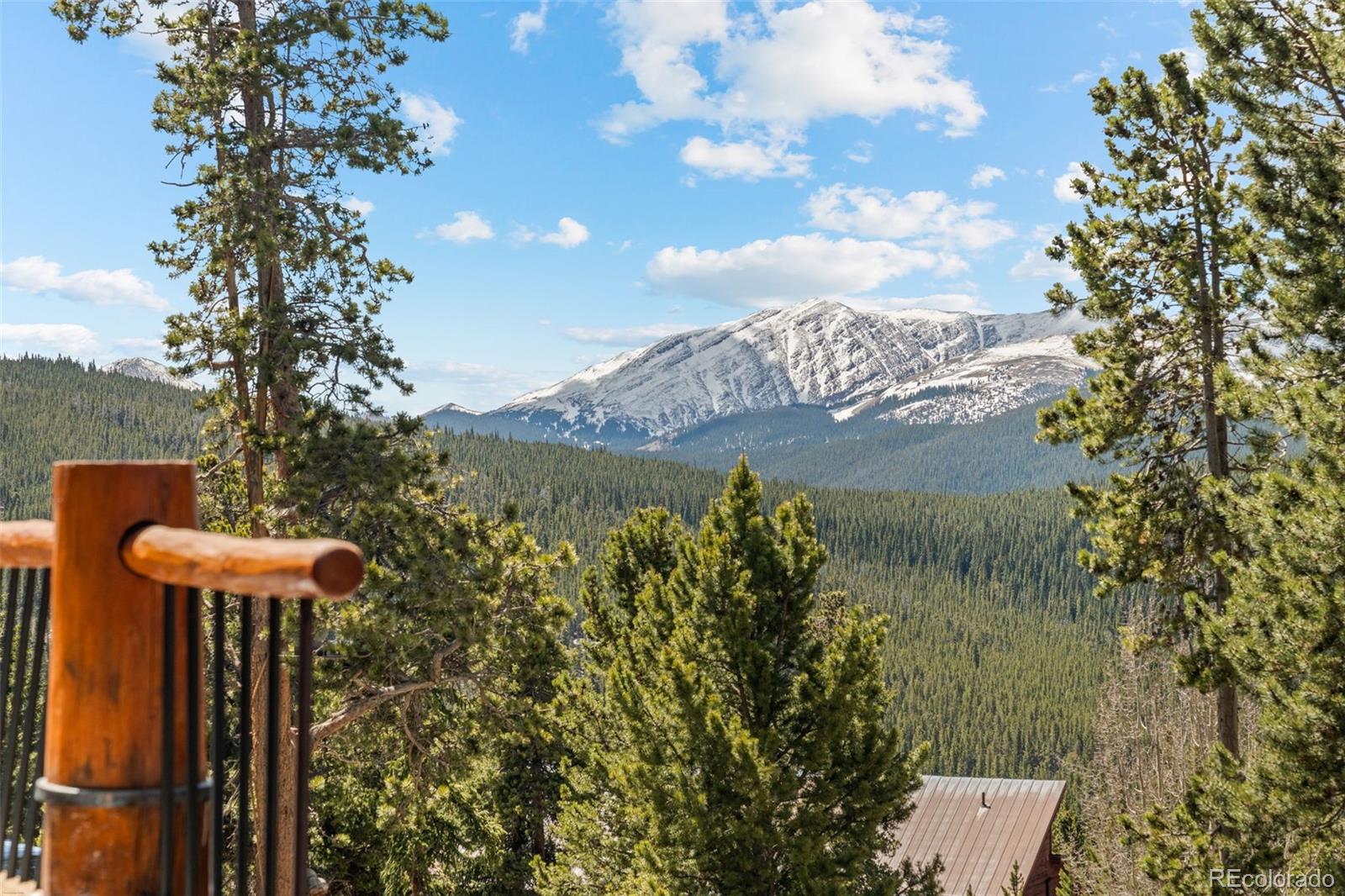 92 Emmett Lode Road, Unit B Breckenridge, CO 80424 - Photo 40 of 50 a view of a lake with a mountain in the background