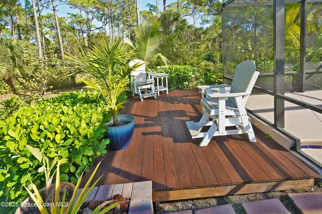 a view of a chairs in backyard of house