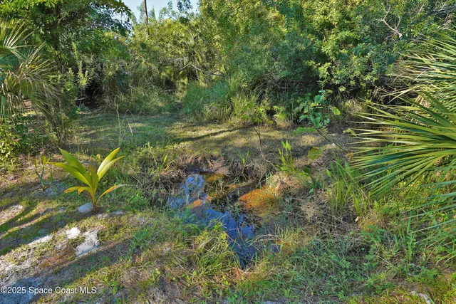 a view of a porch with furniture and a gate