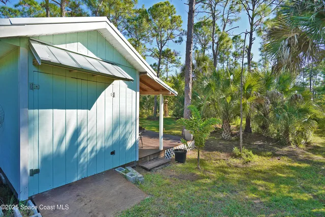 a view of a backyard with wooden floor