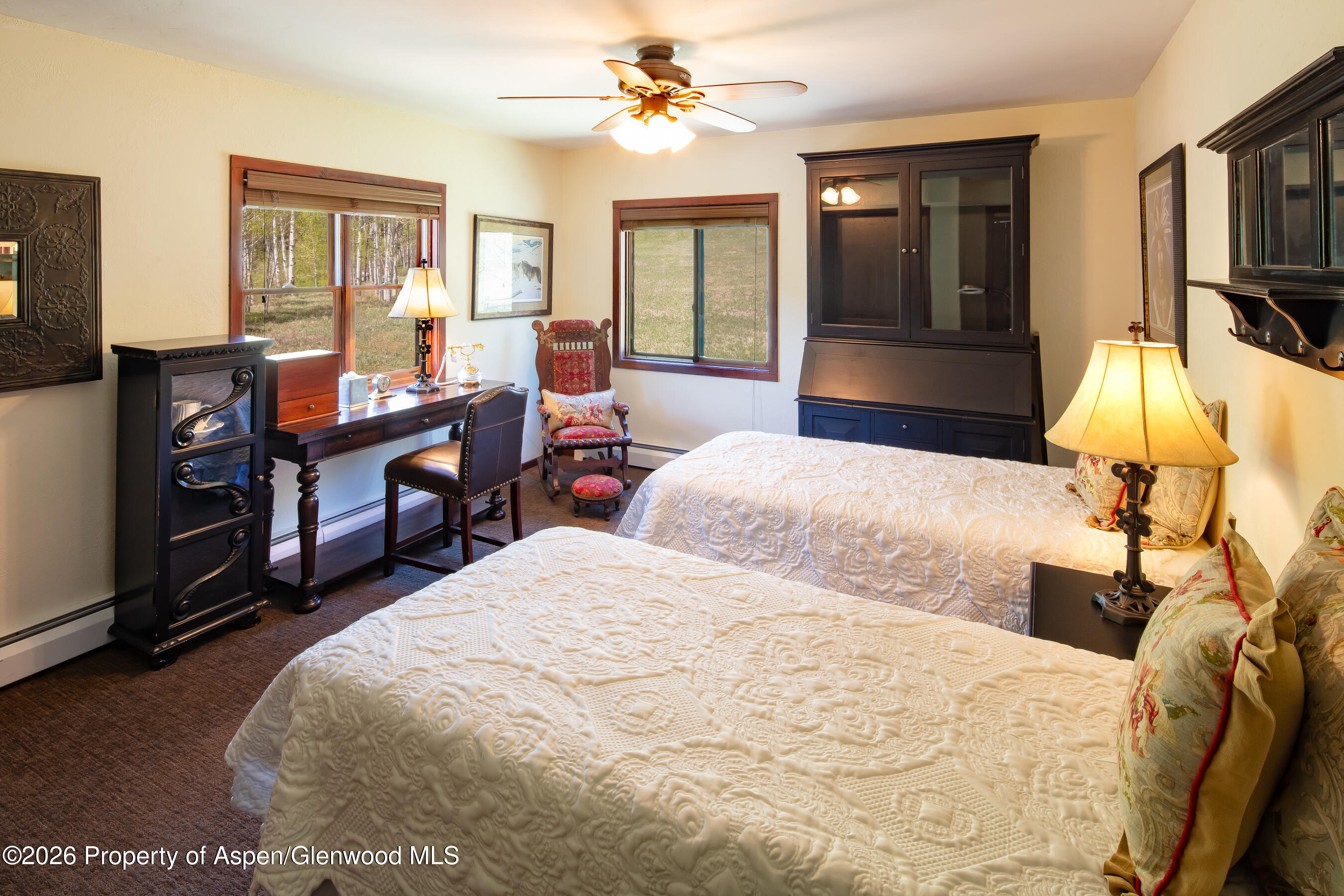 294 Ruedi Creek Road Basalt, CO 81621 - Photo 16 of 27 a bedroom with a bed wooden floor and window
