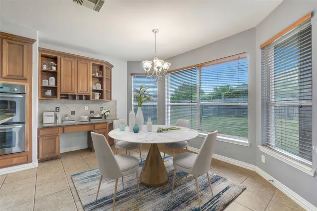 a kitchen with granite countertop a stove and a sink