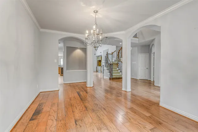 a living room with furniture a window and a dining table