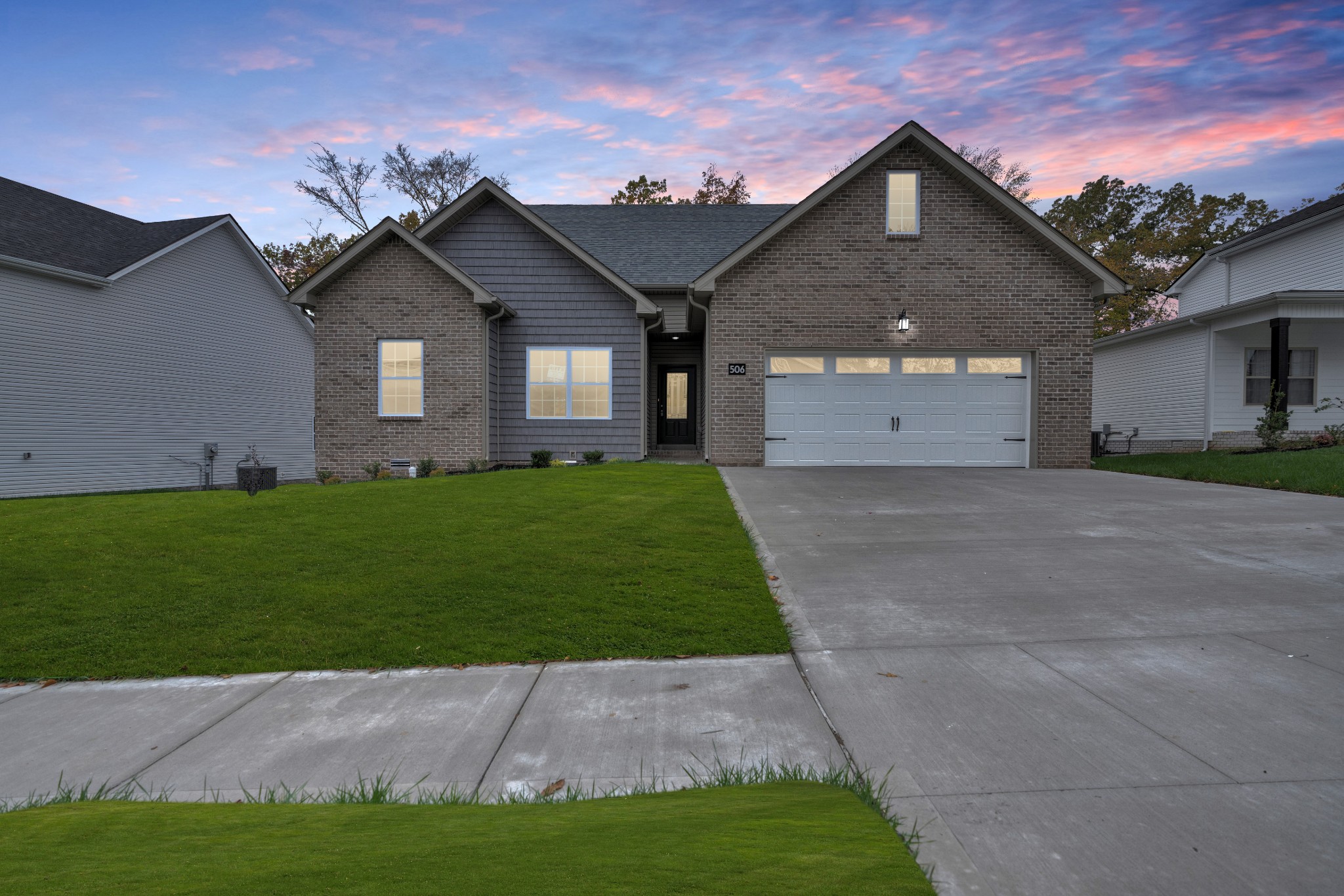 26 Cornerstone Reserves Clarksville, TN 37040 - Photo 1 of 28 a front view of a house with a yard and garage