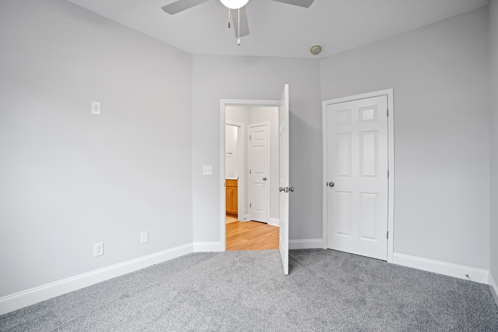 26 Cornerstone Reserves Clarksville, TN 37040 - Photo 19 of 28 an empty room with a hallway and a chandelier fan