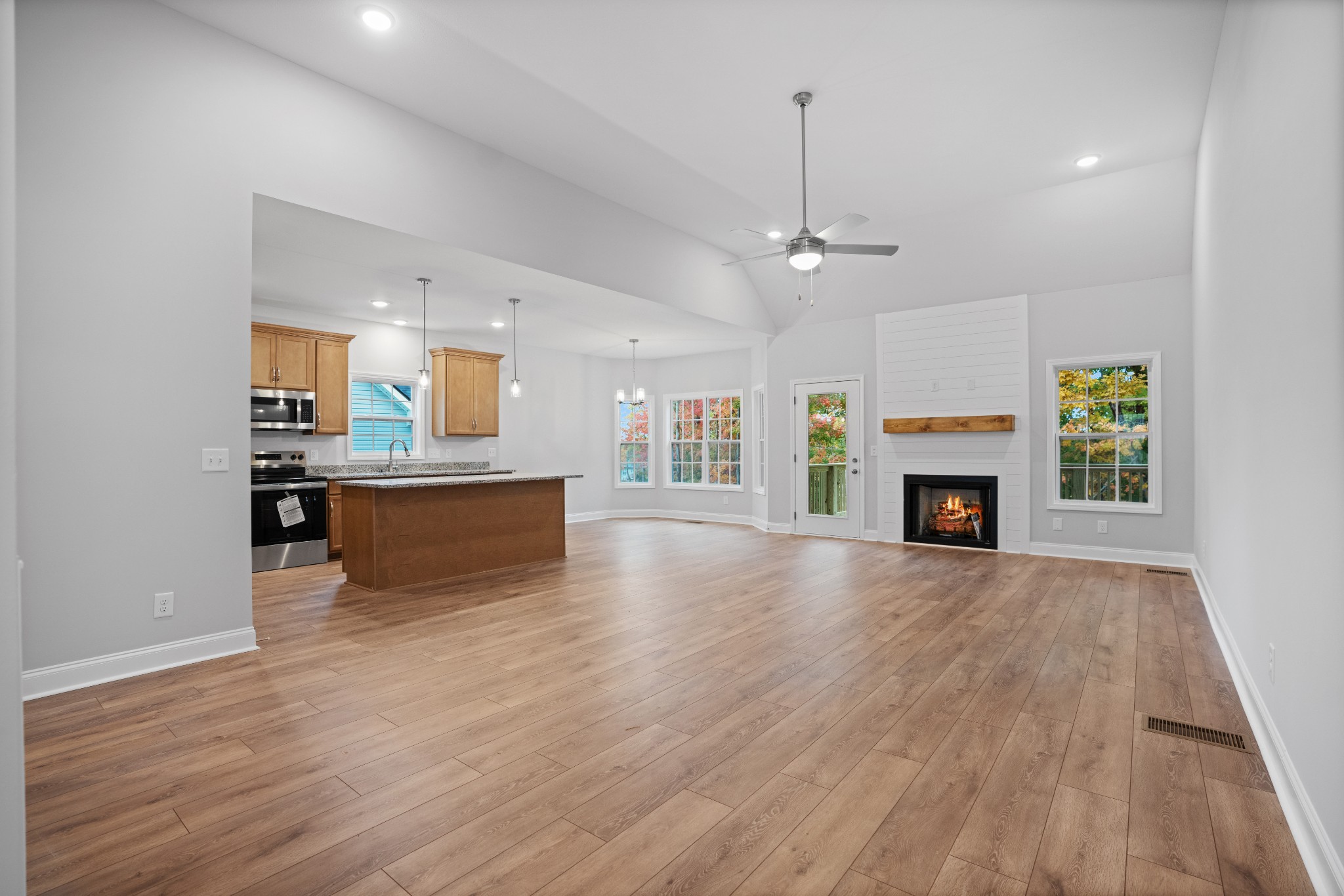 26 Cornerstone Reserves Clarksville, TN 37040 - Photo 3 of 28 a view of kitchen and kitchen with sink hardwood floor and a fireplace