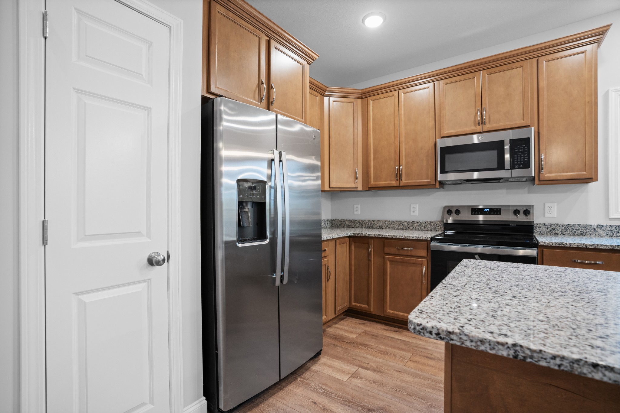 26 Cornerstone Reserves Clarksville, TN 37040 - Photo 9 of 28 a kitchen with stainless steel appliances granite countertop a refrigerator stove and microwave