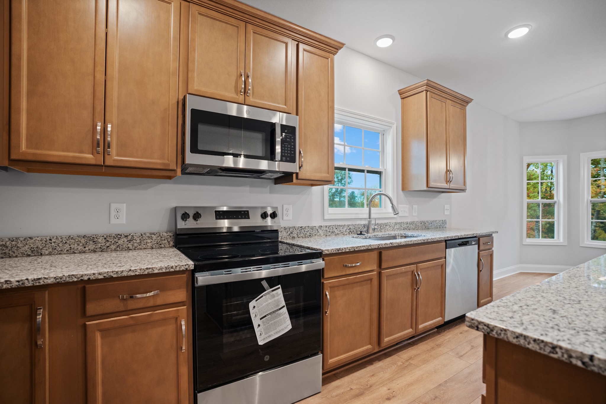 26 Cornerstone Reserves Clarksville, TN 37040 - Photo 10 of 28 a kitchen with stainless steel appliances granite countertop a stove a sink and a microwave