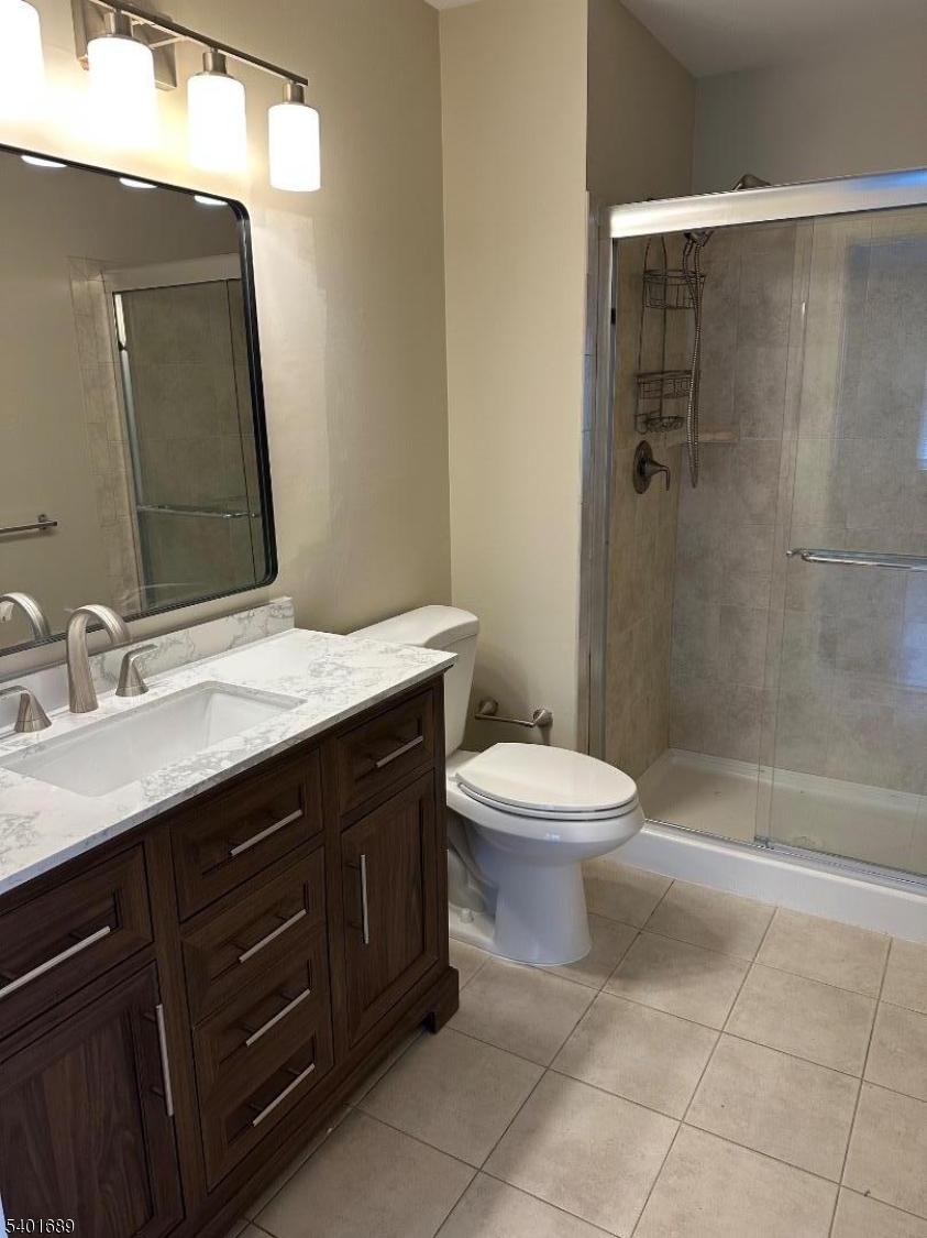 236 Irving Place Basking Ridge, NJ 07920 - Photo 11 of 18 a bathroom with a sink a toilet and shower