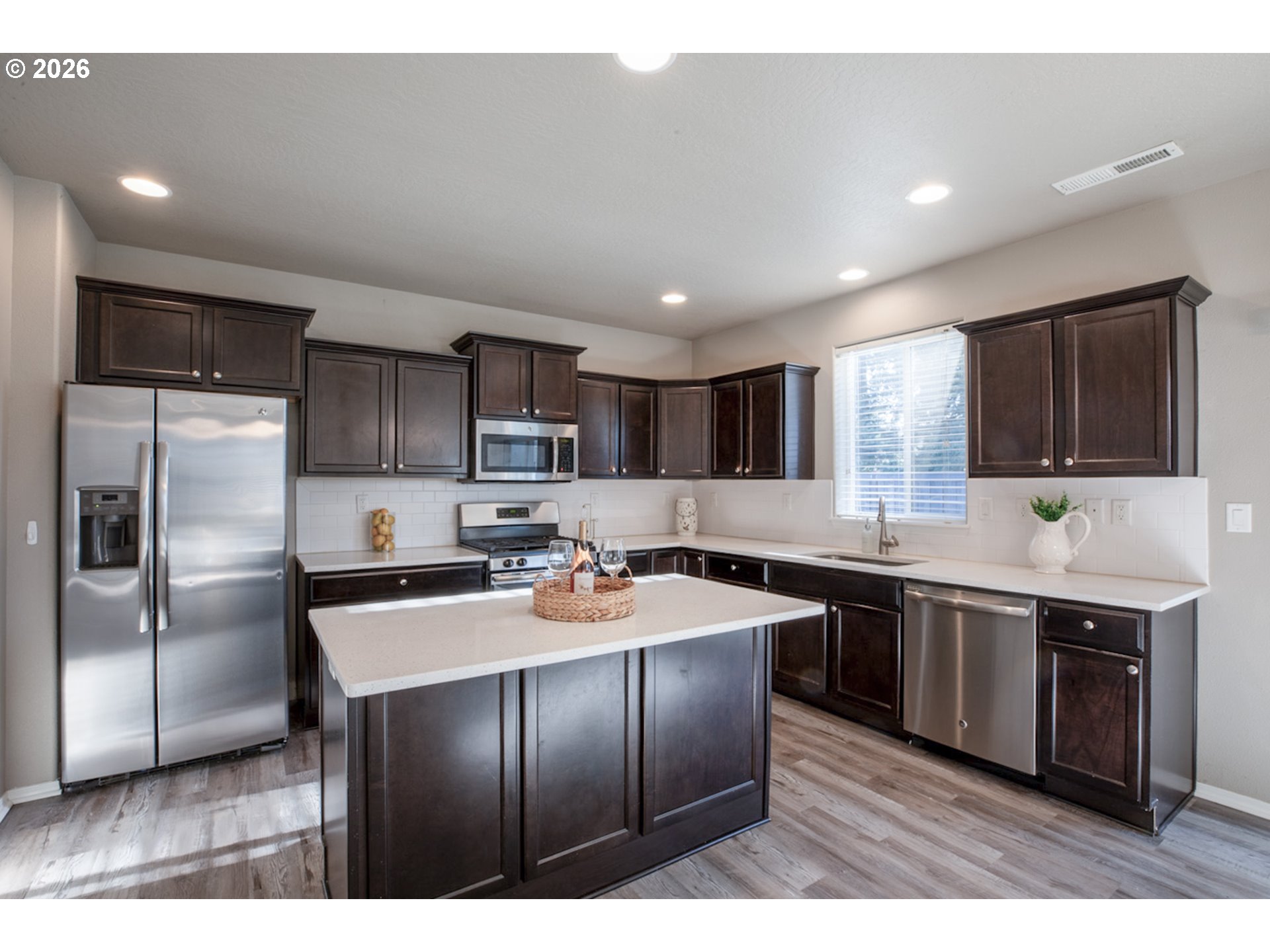 2952 Shelby Way Eugene, OR 97404 - Photo 9 of 25 a kitchen with stainless steel appliances granite countertop a sink stove and refrigerator