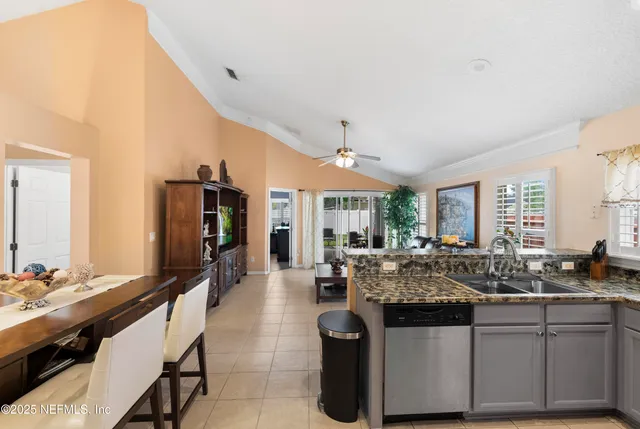 a kitchen with granite countertop a sink and counter