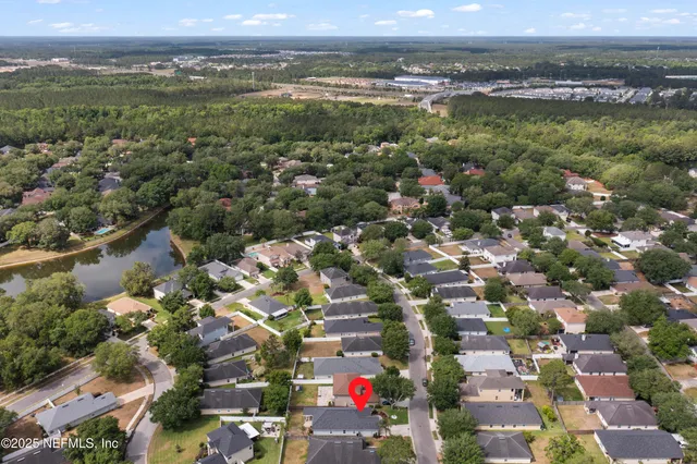 an aerial view of city and lake