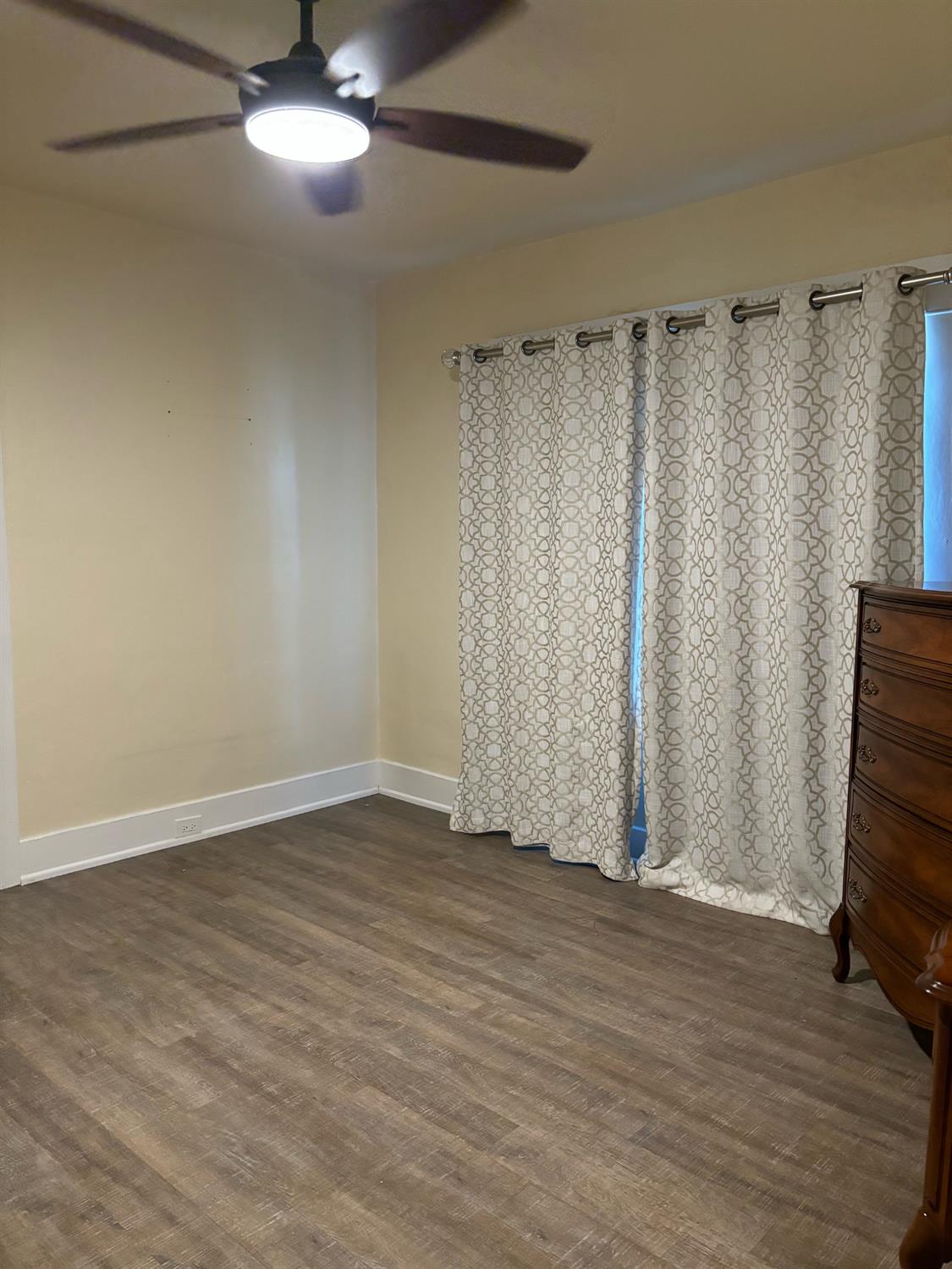 417 Enslen Avenue Modesto, CA 95354 - Photo 16 of 24 a view of a room with wooden floor and fan