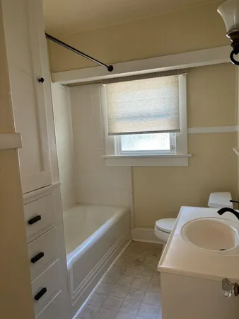 a bathroom with sink and bathtub