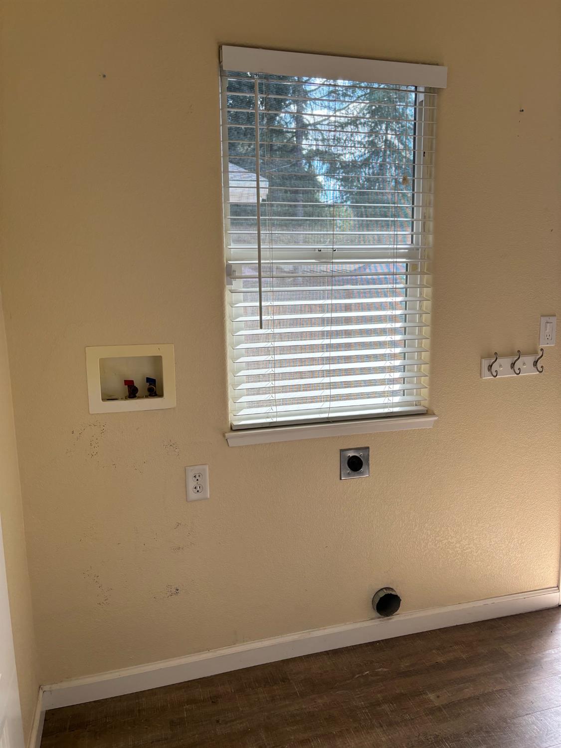 417 Enslen Avenue Modesto, CA 95354 - Photo 21 of 24 a view of a small space with wooden floor and a window