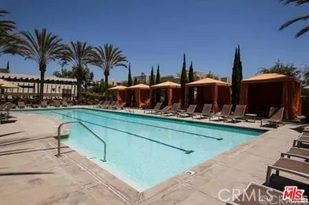 a view of swimming pool with outdoor seating