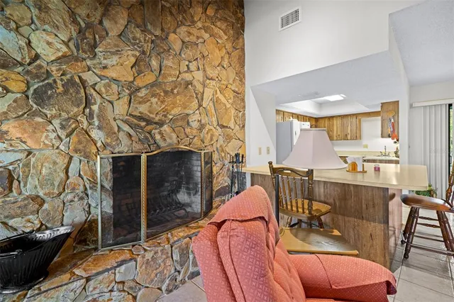 a kitchen with stainless steel appliances granite countertop a refrigerator sink and cabinets