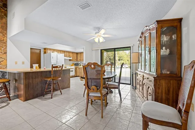 a kitchen with granite countertop a sink stove and cabinets