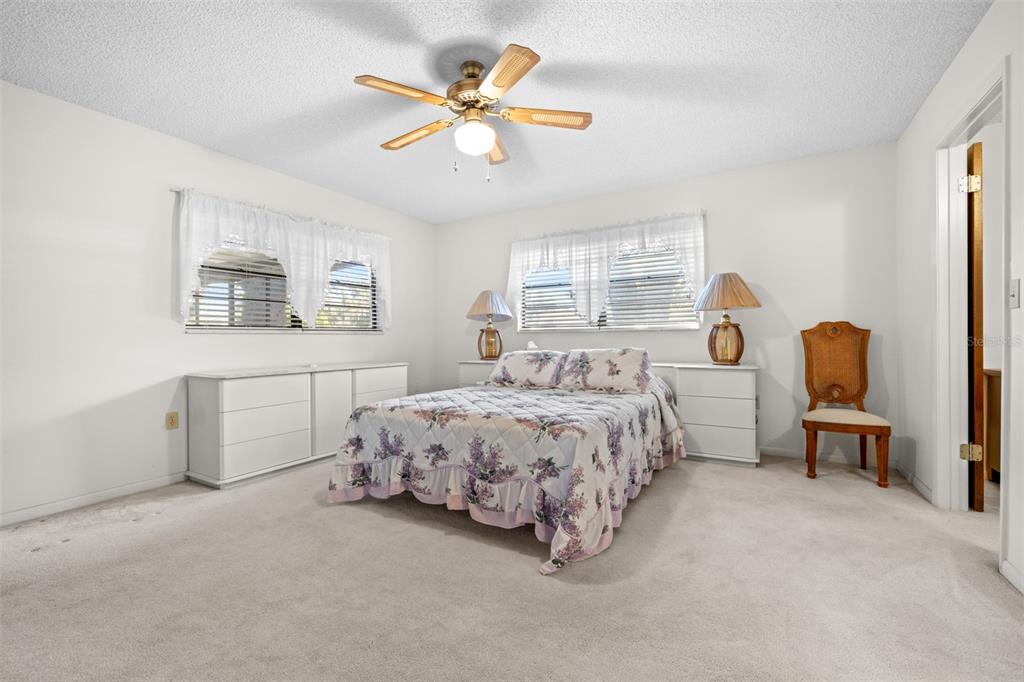 623 Racoon Lane Lorida, FL 33857 - Photo 21 of 80 a spacious bedroom with a bed dresser and a window