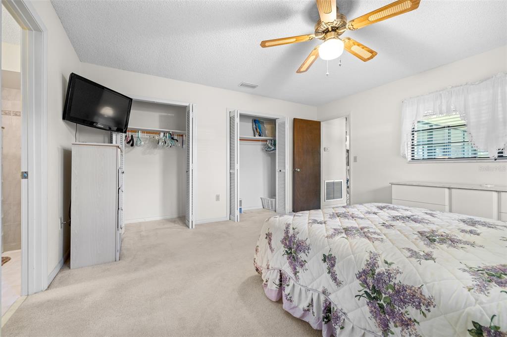 623 Racoon Lane Lorida, FL 33857 - Photo 22 of 80 a bedroom with a bed and a flat screen tv