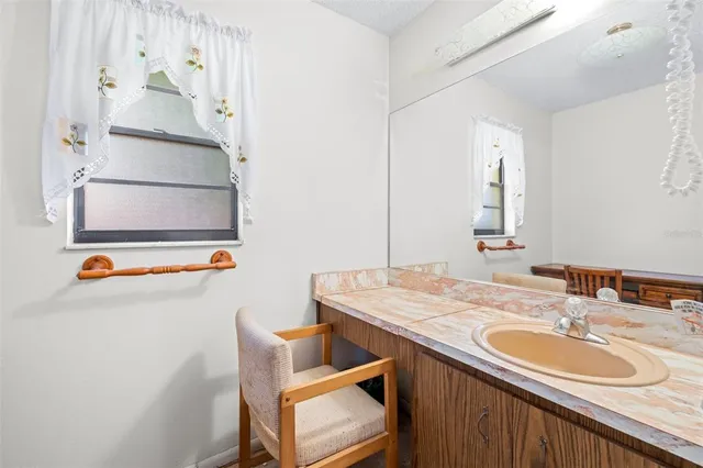 a bathroom with a shower and a sink