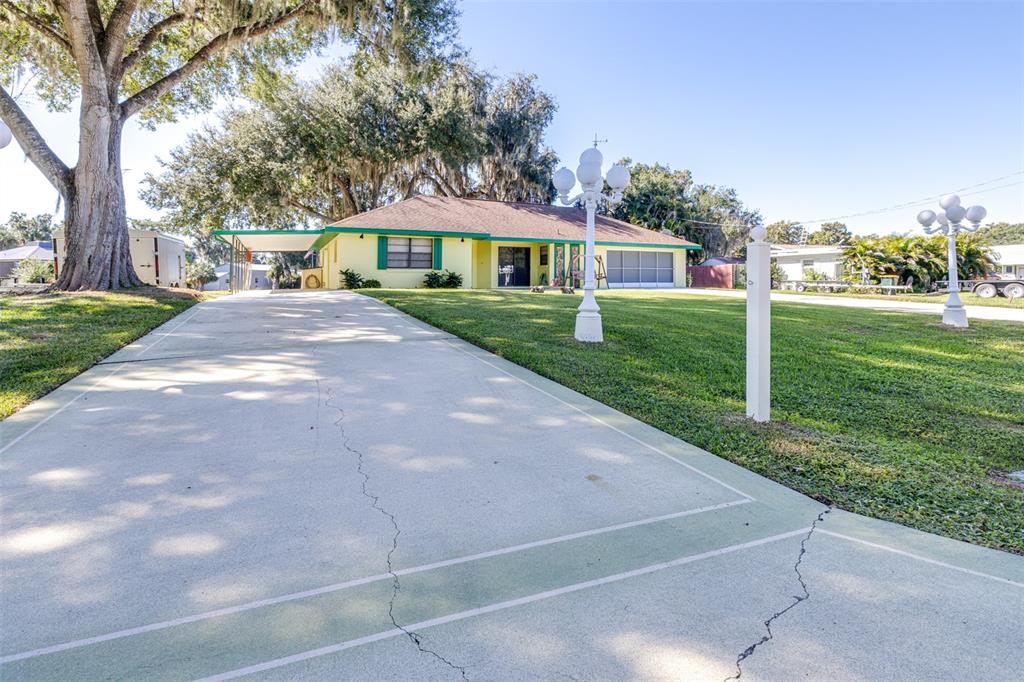 623 Racoon Lane Lorida, FL 33857 - Photo 3 of 80 a front view of a house with a yard