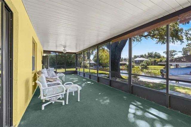 a view of a lake with a table and chairs