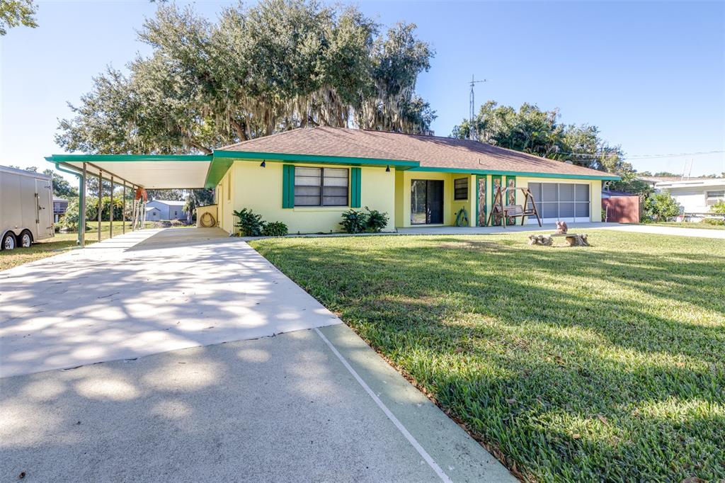 623 Racoon Lane Lorida, FL 33857 - Photo 4 of 80 a front view of a house with a yard