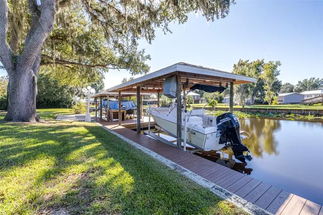an aerial view of residential houses with outdoor space and swimming pool