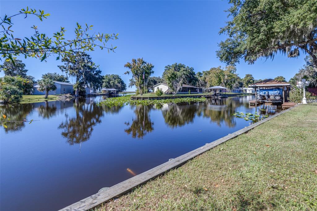 623 Racoon Lane Lorida, FL 33857 - Photo 6 of 80 a view of a lake with houses in the back