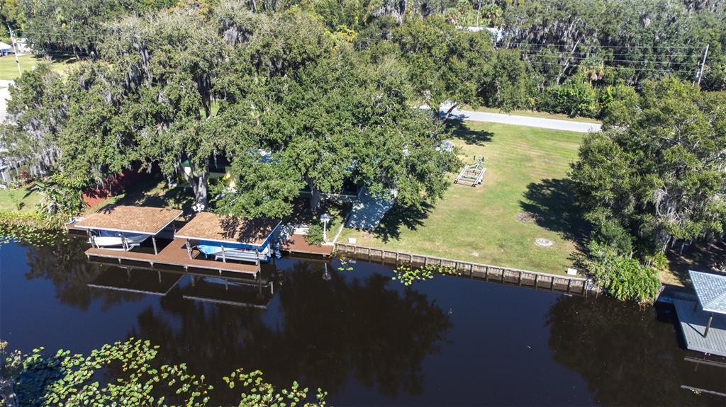 623 Racoon Lane Lorida, FL 33857 - Photo 67 of 80 a view of a lake with a yard