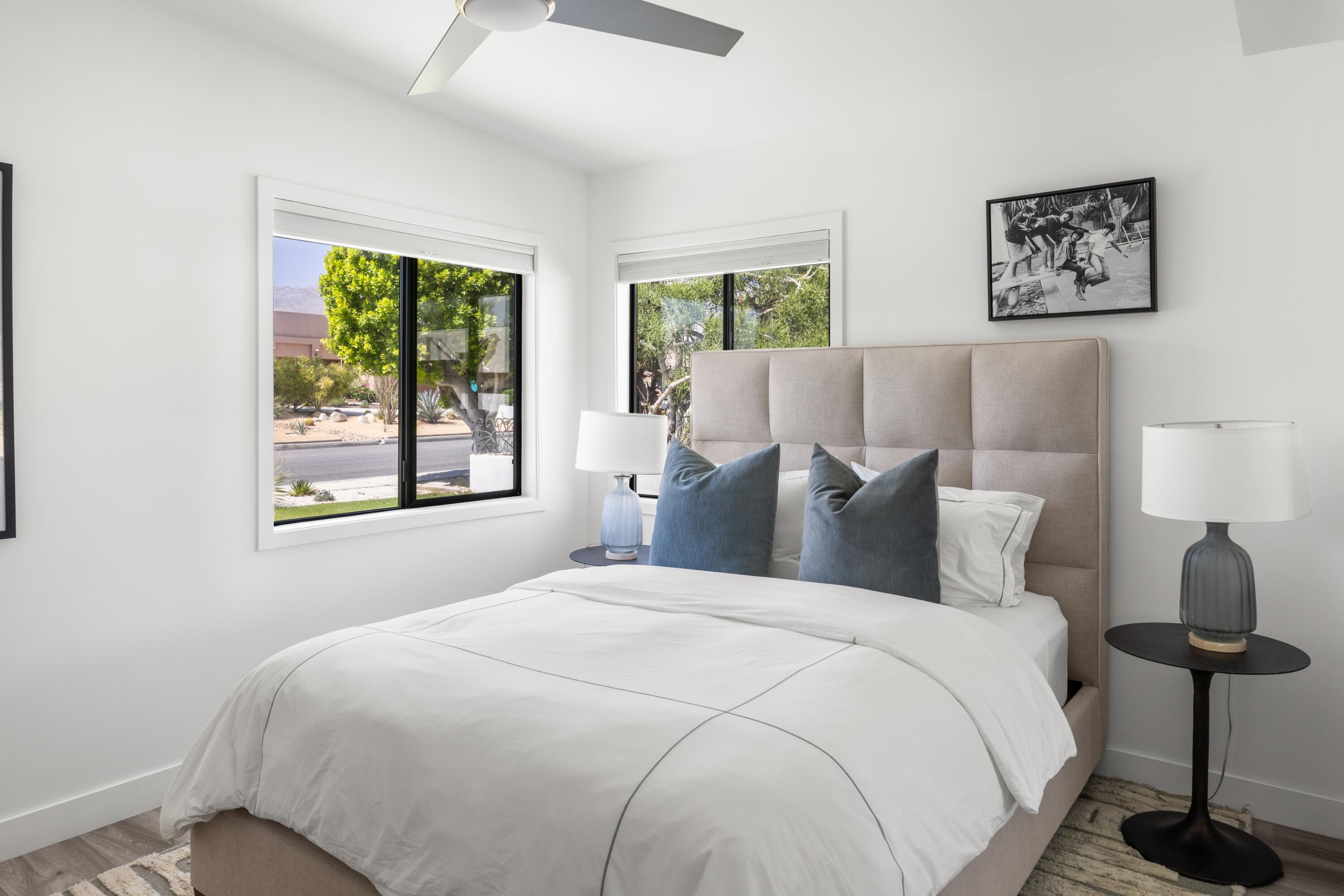 72870 Bel Air Road, Unit 3 Palm Desert, CA 92260 - Photo 11 of 36 a bedroom with a large bed and a window