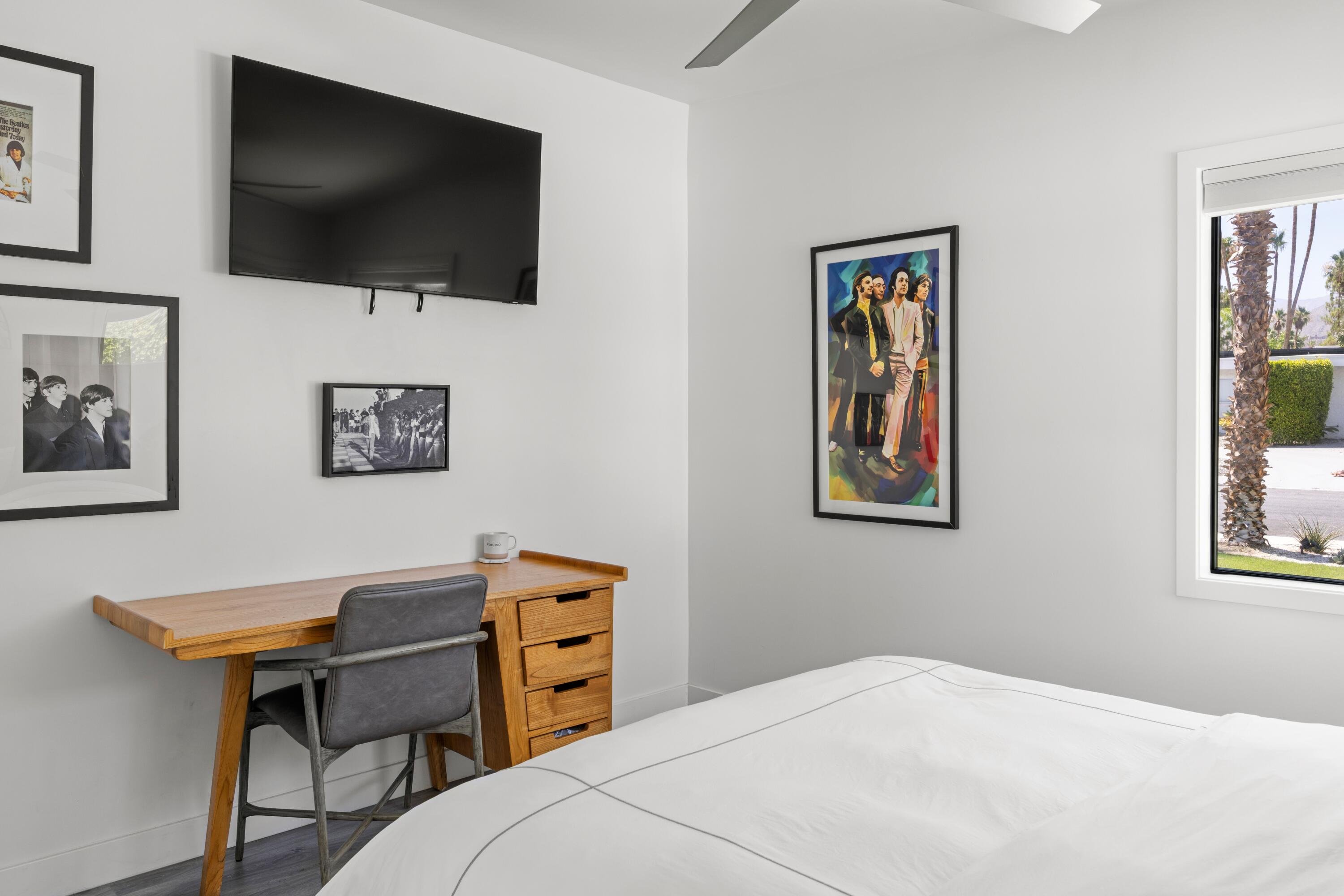 72870 Bel Air Road, Unit 3 Palm Desert, CA 92260 - Photo 12 of 36 a bedroom with a bed and a flat screen tv