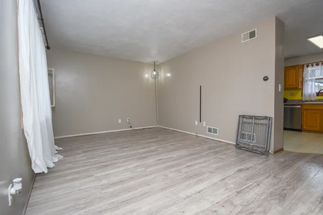 a view of a livingroom with wooden floor