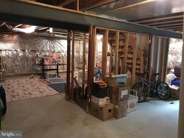 a view of gym with large windows