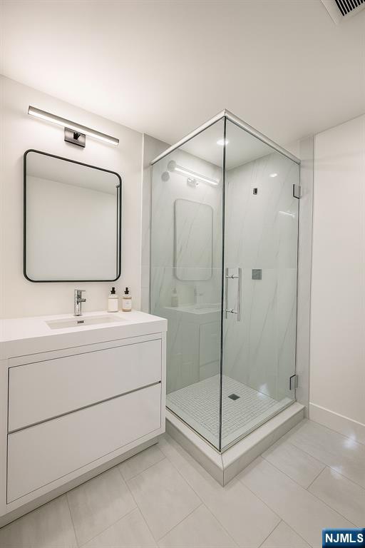 46 Overlook Road Alpine, NJ 07620 - Photo 12 of 18 a bathroom with a shower sink and mirror