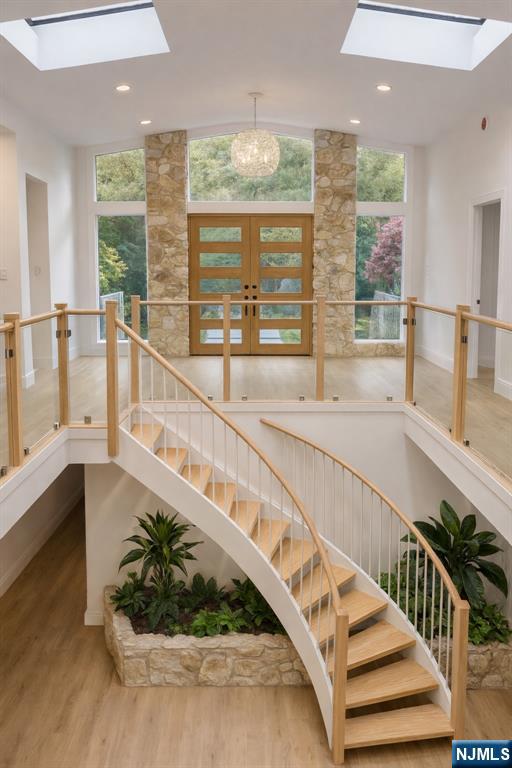 46 Overlook Road Alpine, NJ 07620 - Photo 2 of 18 a view of staircase with a large window and wooden floor