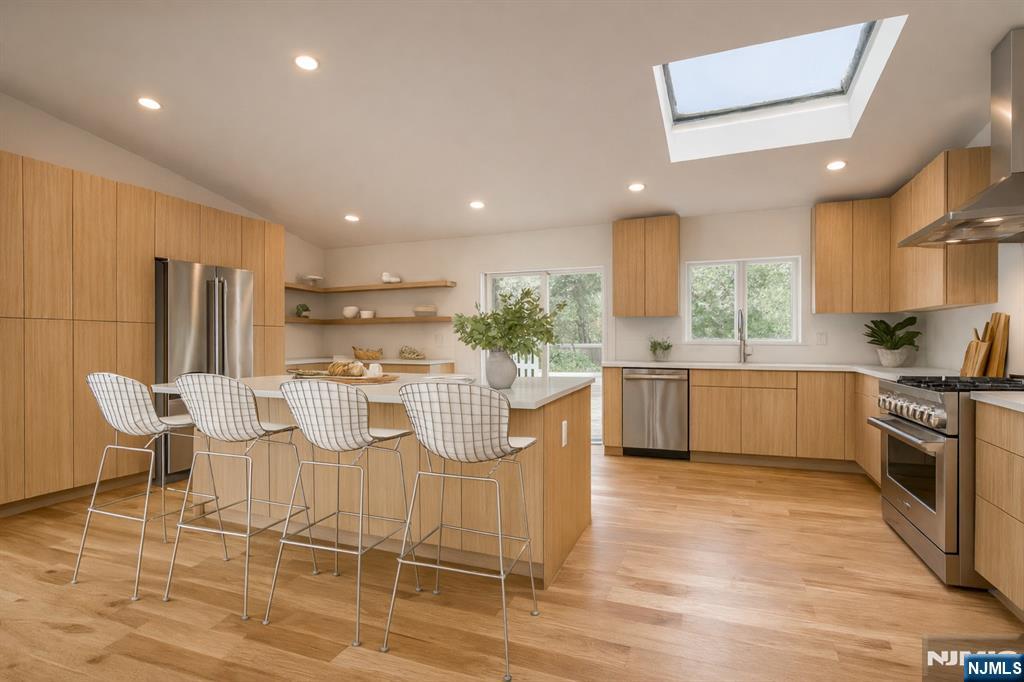 46 Overlook Road Alpine, NJ 07620 - Photo 5 of 18 a kitchen with a sink cabinets and wooden floor