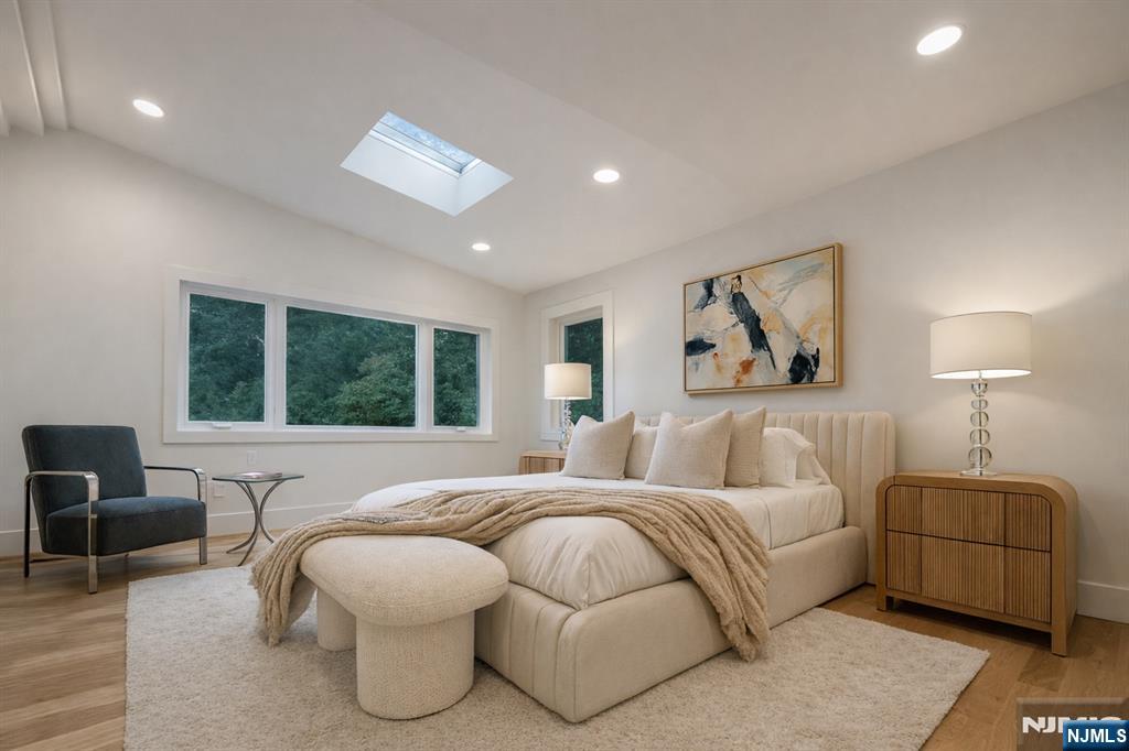 46 Overlook Road Alpine, NJ 07620 - Photo 7 of 18 a bedroom with a bed and glass walk in closet