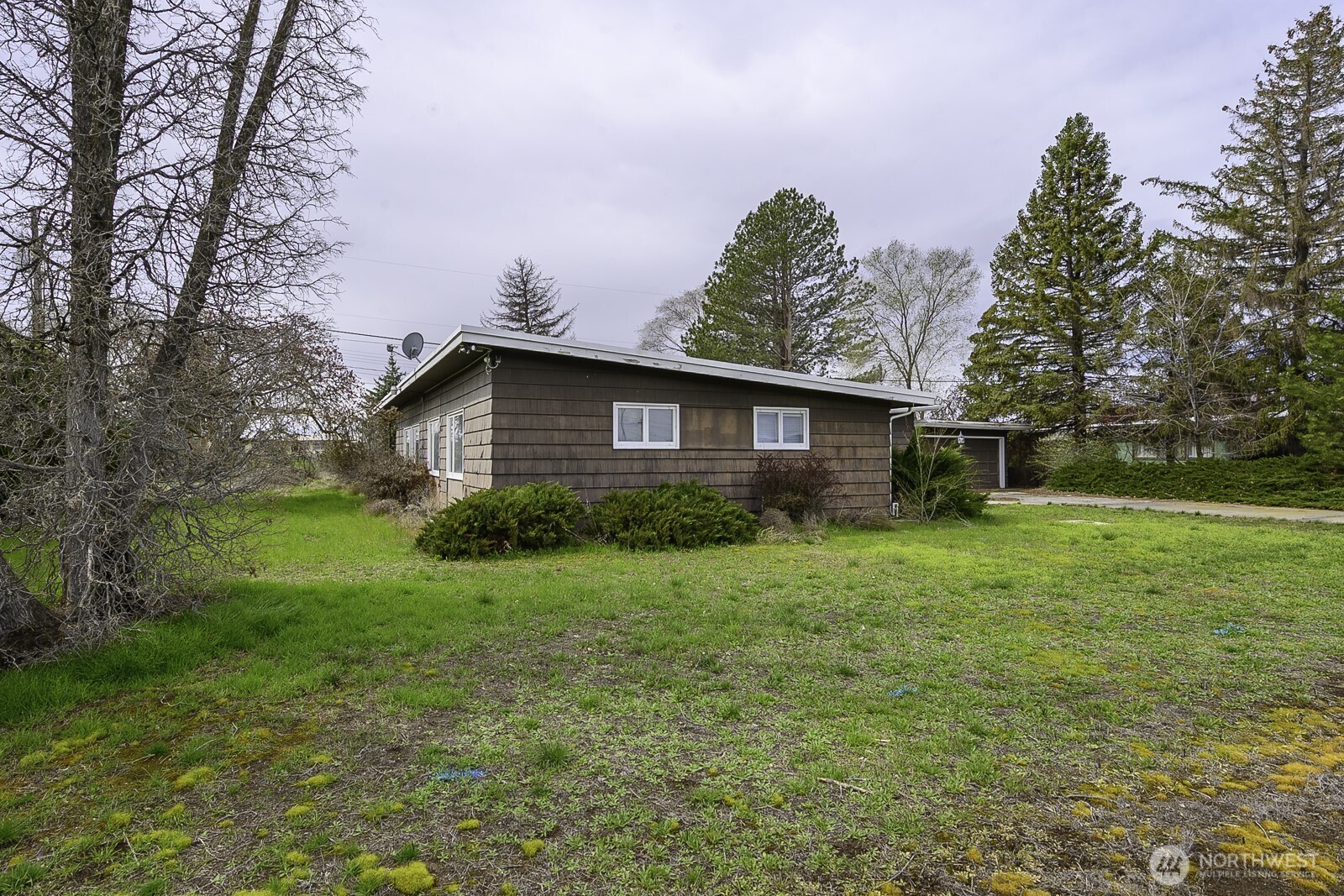 537 Fairchild Loop Moses Lake, WA 98837 - Photo 32 of 34 a view of a house with yard and tree s