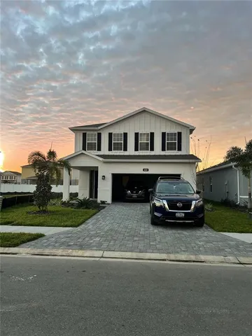 a car parked in front of a house