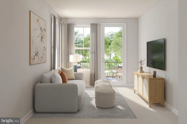 a living room with furniture a flat screen tv and a window