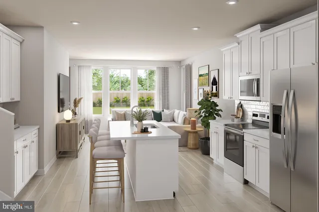 a kitchen with a refrigerator and a stove top oven