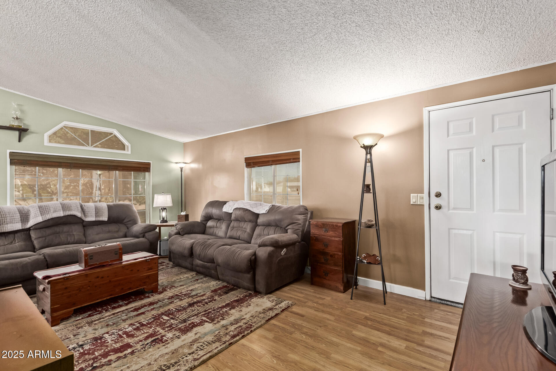 164 North Wickiup Road Apache Junction, AZ 85119 - Photo 12 of 62 a living room with furniture and a window