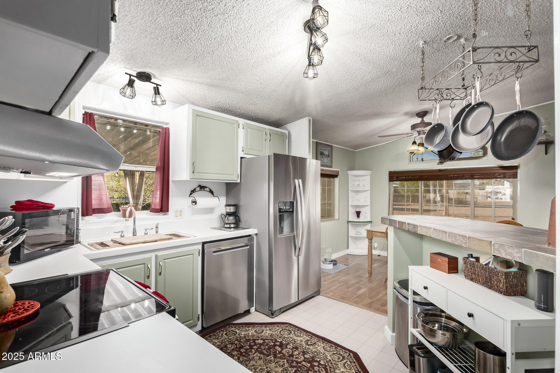164 North Wickiup Road Apache Junction, AZ 85119 - Photo 18 of 62 a kitchen that has a lot of cabinets a sink and appliances in it