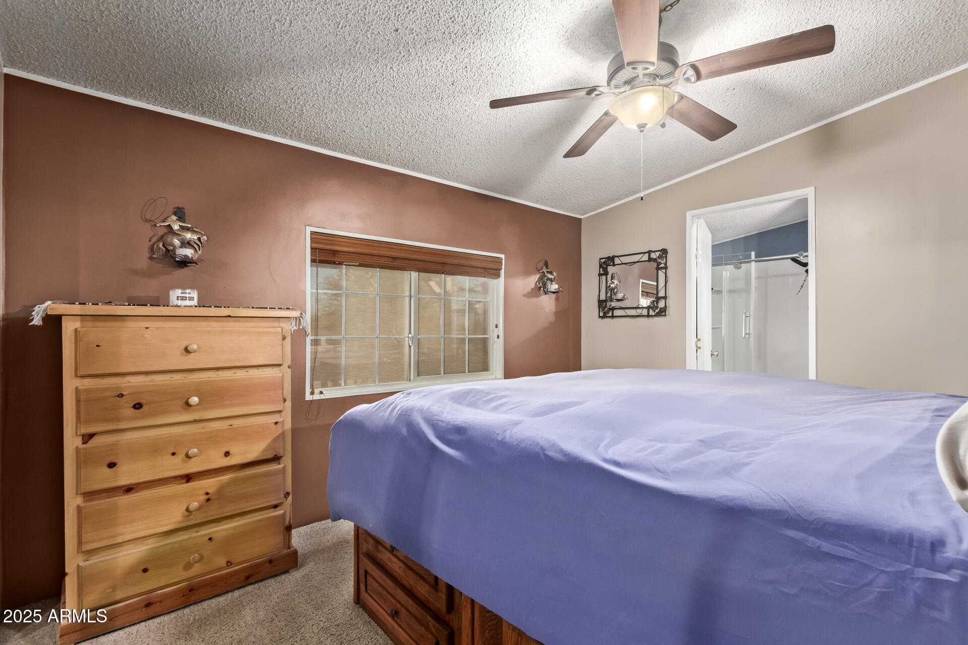 164 North Wickiup Road Apache Junction, AZ 85119 - Photo 20 of 62 a bedroom with a bed and a dresser