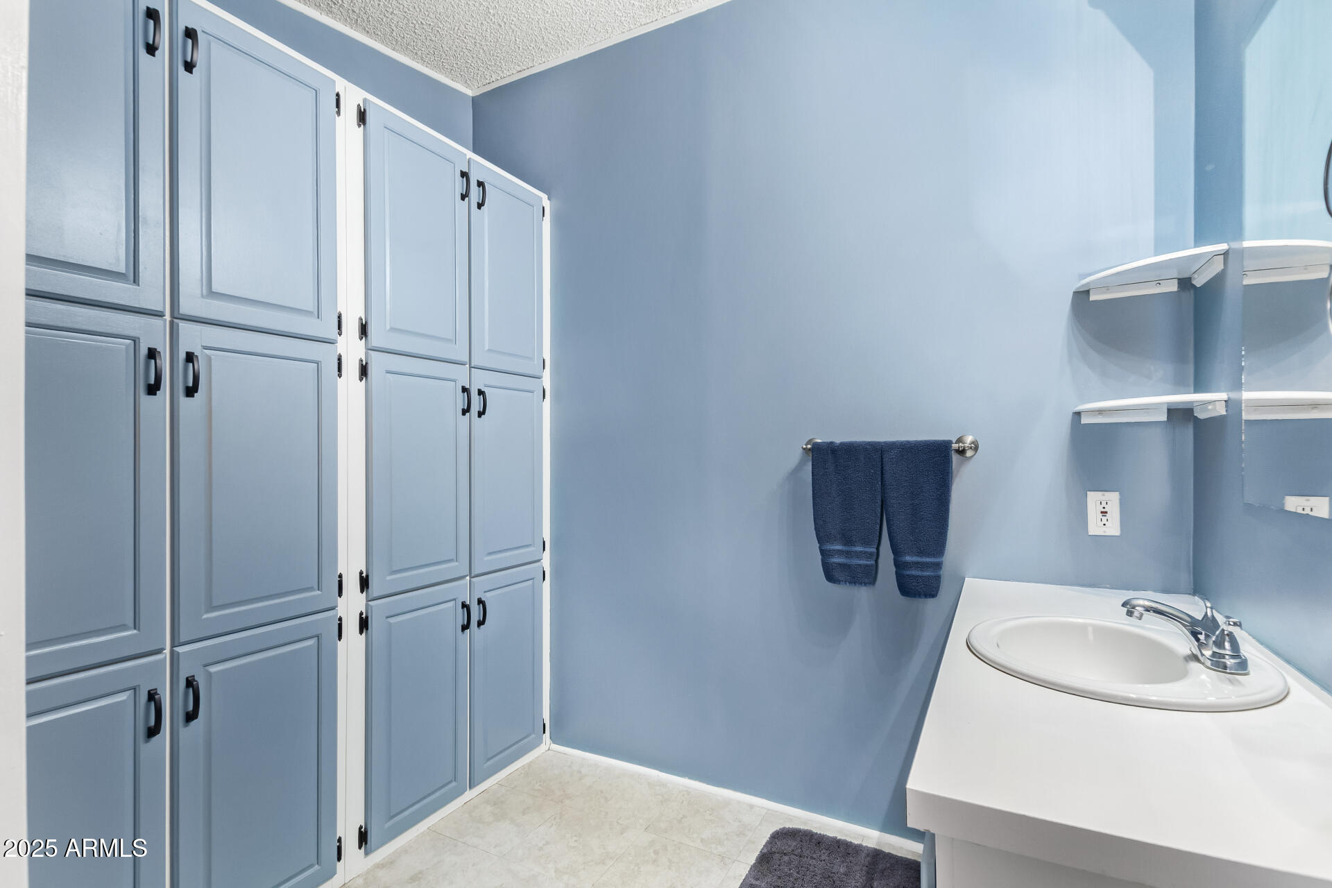164 North Wickiup Road Apache Junction, AZ 85119 - Photo 23 of 62 a bathroom with a sink and toilet