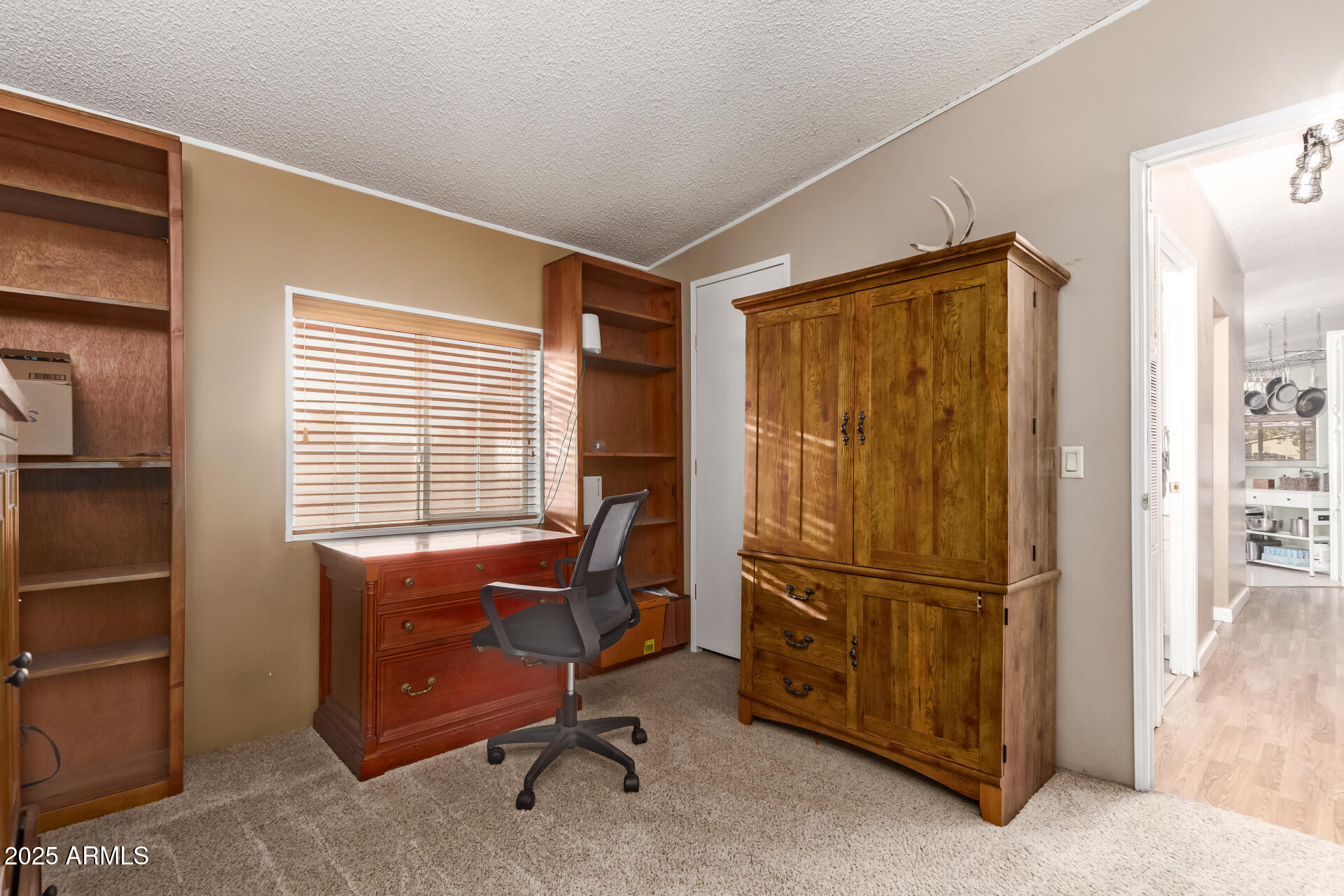 164 North Wickiup Road Apache Junction, AZ 85119 - Photo 27 of 62 a view of a workspace with furniture and a window
