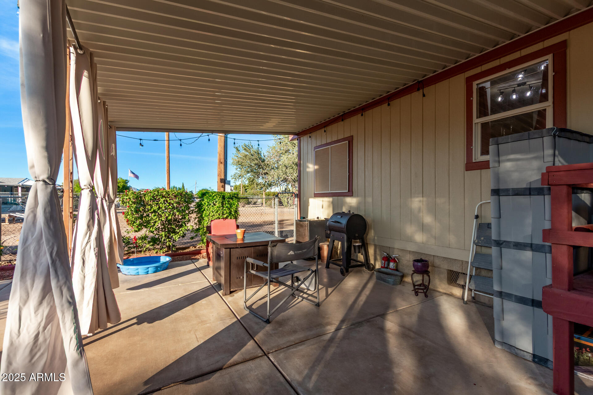 164 North Wickiup Road Apache Junction, AZ 85119 - Photo 33 of 62 a view of a patio with table and chairs and potted plants