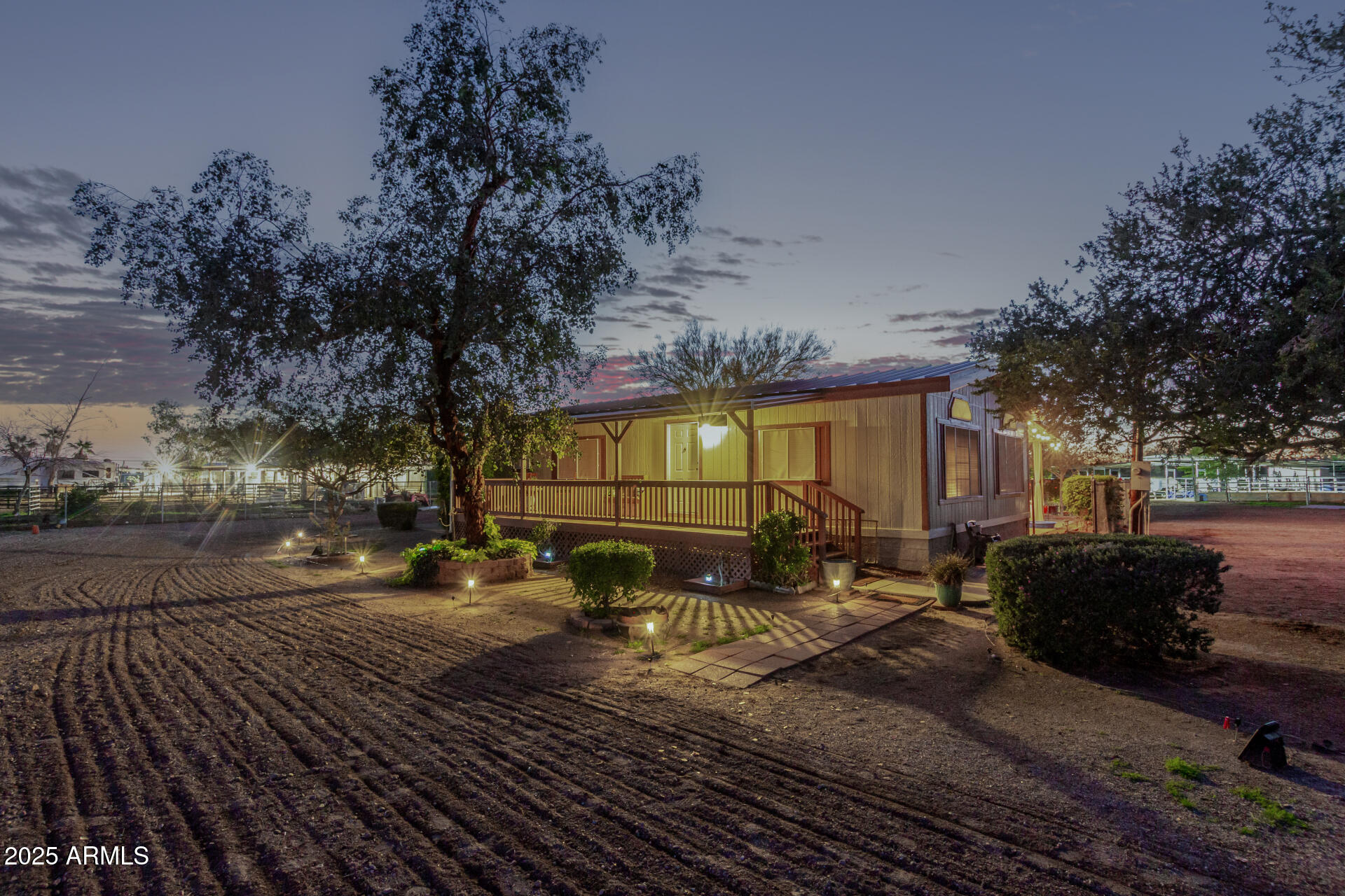 164 North Wickiup Road Apache Junction, AZ 85119 - Photo 49 of 62 a view of a patio with table and chairs with wooden floor and fence